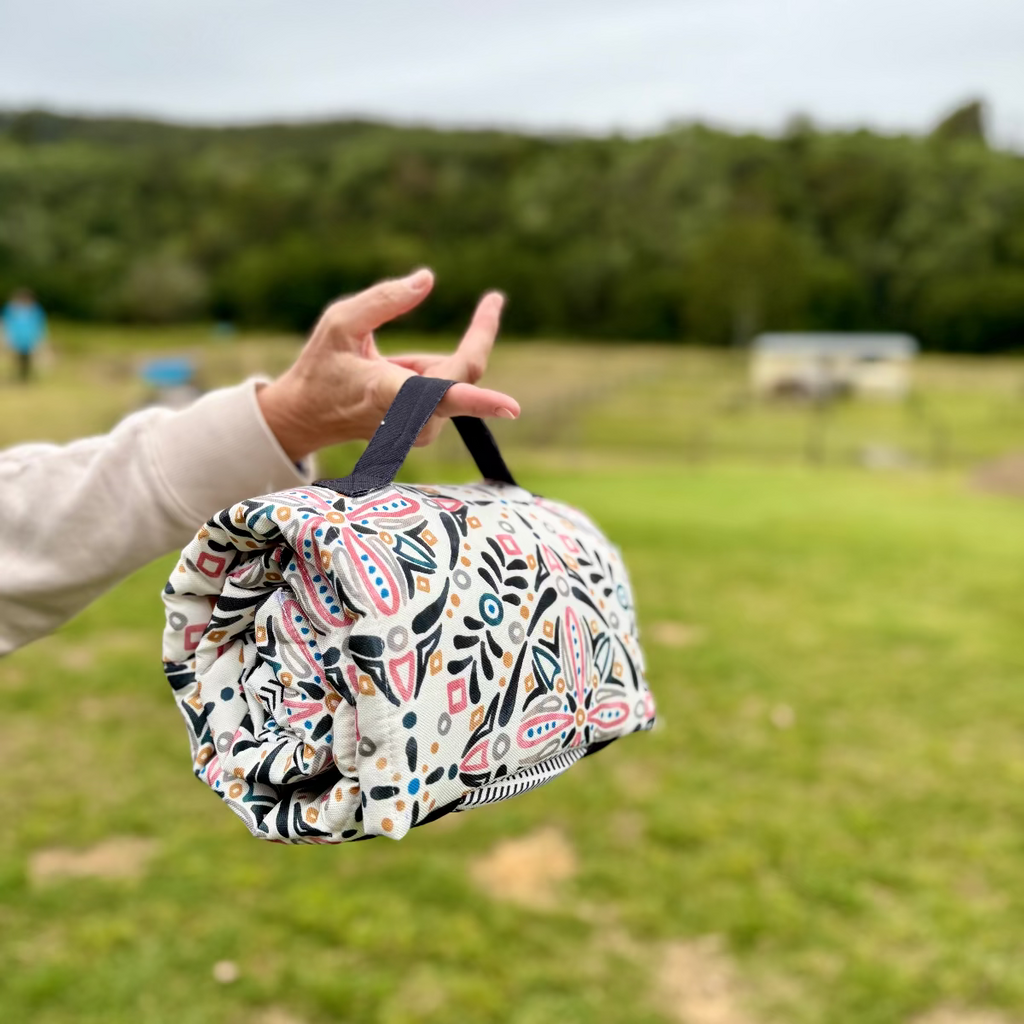Audrey roll-up double-sided dog training mat in durable canvas
Audrey portable dog bed rolled up with carry straps
Audrey travel dog mat laid flat showing double-sided design
Audrey dog training mat used as crate liner for puppy
Audrey washable canvas dog bed in travel setting
Audrey dog mat attached to car headrest as seat protector
Audrey puppy training mat with stylish patterned fabric
Audrey heavy-duty canvas dog bed for home and travel
