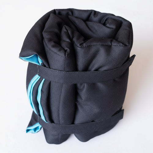 Double-sided dog training mat showing both textured surfaces for grip and comfort, designed for calm training sessions with dogs at home or on the go.