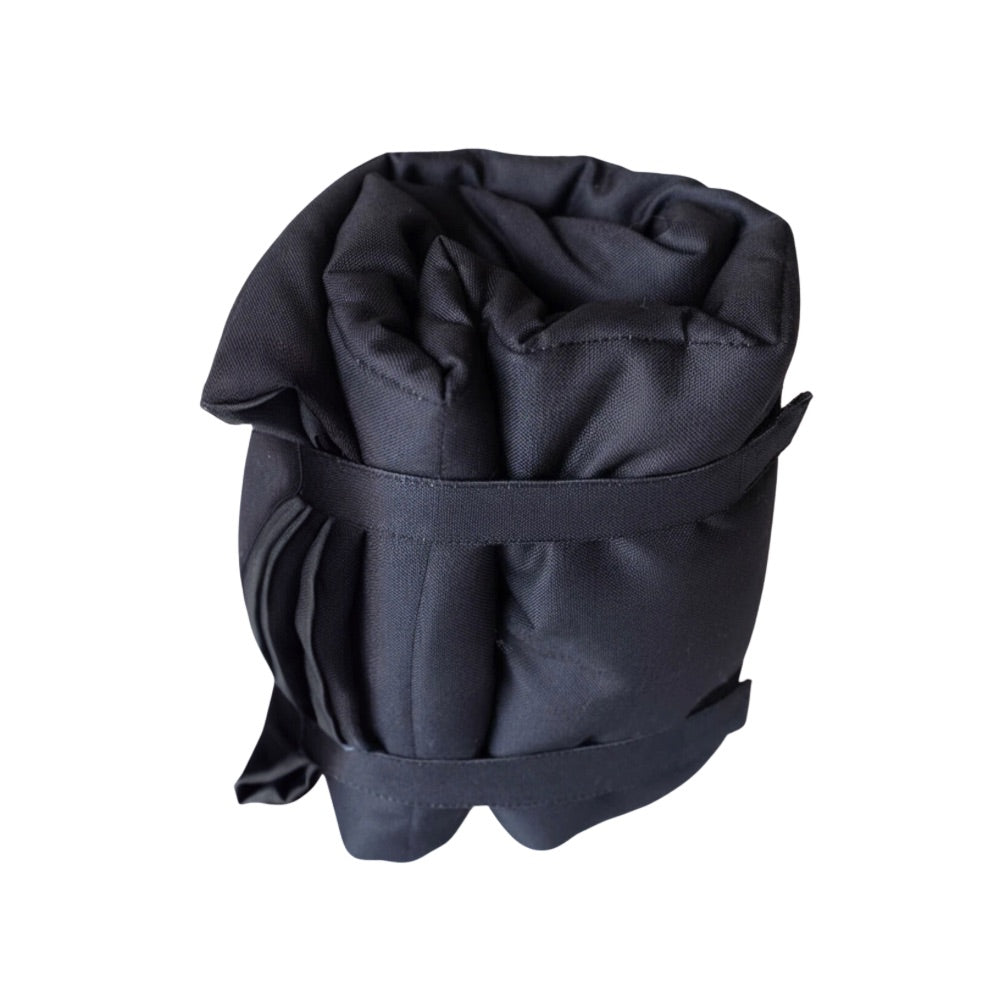 Double-sided dog training mat showing both textured surfaces for grip and comfort, designed for calm training sessions with dogs at home or on the go.